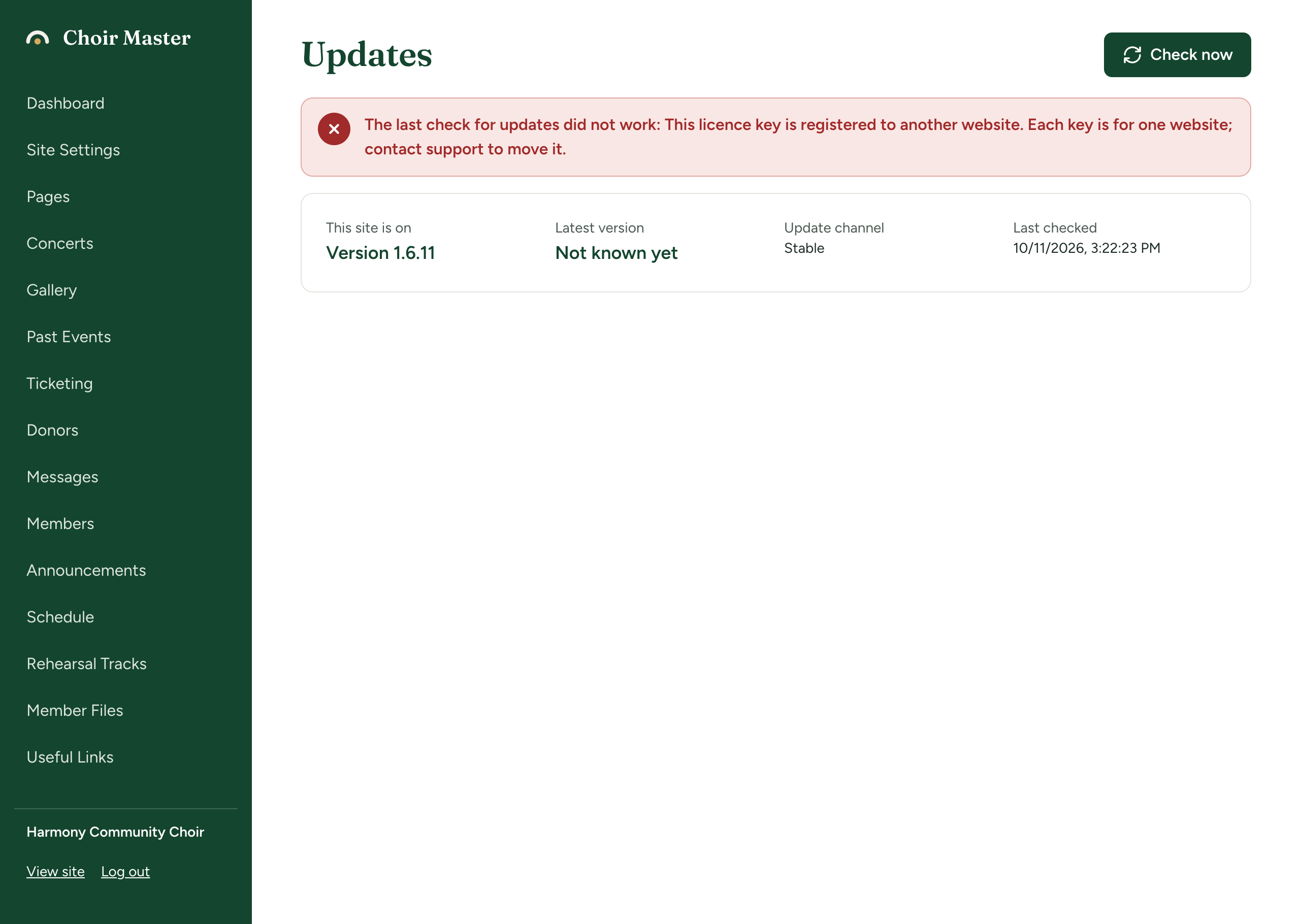 The Updates page showing the red message that the licence key is registered to another website